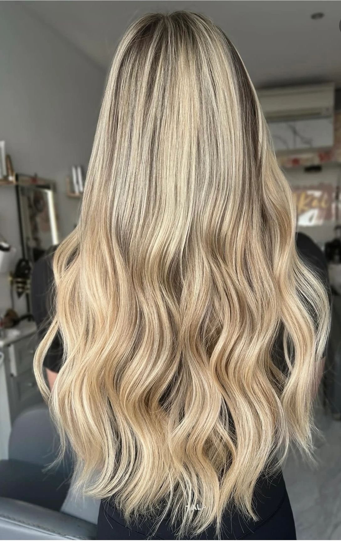 Long blonde extensions by AKAI